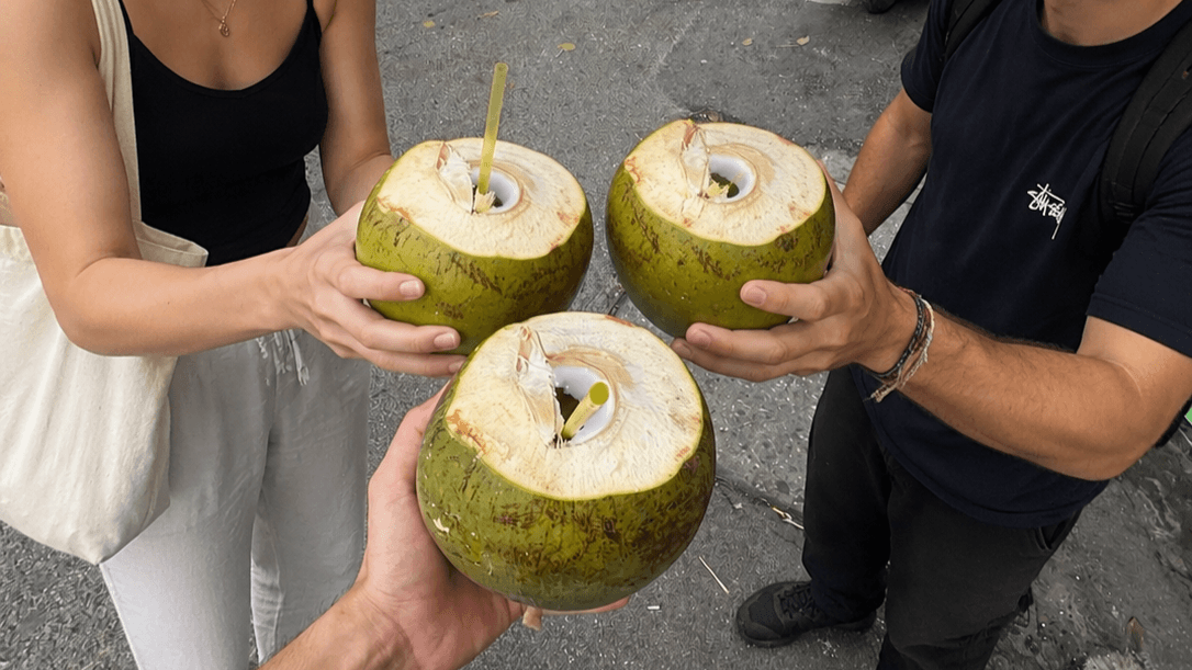 Group cheering with coconuts.